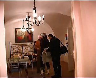 Two studs get blowjobs from mature MILF in hotel room